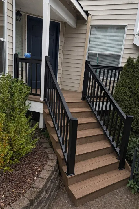 Front steps rebuilt in composite with black balusters