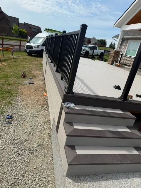 Deck corner detail with dark border and metal railing