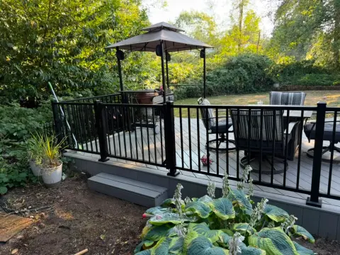 Deck with gazebo and outdoor furniture by the greenbelt