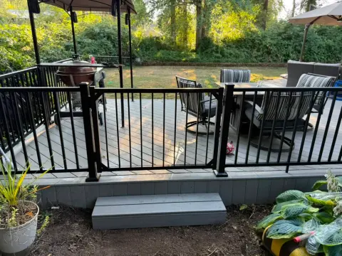 Outdoor dining area on a new deck under a gazebo