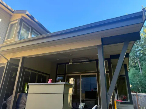 Covered patio structure with new roof over the deck
